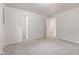 Neutral bedroom with carpet, closet, and two doors leading to other rooms at 6310 Kellum Dr, Indianapolis, IN 46221