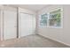 Bedroom features carpet, closet, and window views at 6310 Kellum Dr, Indianapolis, IN 46221