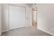 Bedroom with carpet, closet, view to adjacent bathroom at 6310 Kellum Dr, Indianapolis, IN 46221