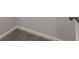 Close-up shows carpeted corner with gray walls and white trim at 6310 Kellum Dr, Indianapolis, IN 46221