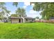 View of the backyard with a large grassy area at 6310 Kellum Dr, Indianapolis, IN 46221
