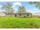 View of the backyard with a large grassy area at 6310 Kellum Dr, Indianapolis, IN 46221