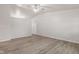 Spacious living room featuring high ceilings, neutral walls, and sleek laminate flooring at 6310 Kellum Dr, Indianapolis, IN 46221