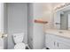 Well-lit bathroom with white vanity and a sink at 6320 River Valley Way, Indianapolis, IN 46221