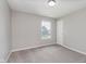 This bedroom has neutral walls, carpeted floors and a window at 6320 River Valley Way, Indianapolis, IN 46221