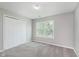 This bedroom has neutral walls, carpeted floors, closet and a window at 6320 River Valley Way, Indianapolis, IN 46221