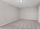 Neutral-toned bedroom with carpet and a large window at 6320 River Valley Way, Indianapolis, IN 46221