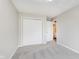 This bedroom has neutral walls, carpeted floors and a closet at 6320 River Valley Way, Indianapolis, IN 46221