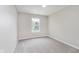 Carpeted bedroom with a bright window offers natural light at 6320 River Valley Way, Indianapolis, IN 46221