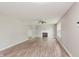 Spacious living room featuring a fireplace, hardwood floors, and abundant natural light at 6320 River Valley Way, Indianapolis, IN 46221