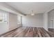 Bright, spacious living room with hardwood floors and plenty of natural light at 6320 River Valley Way, Indianapolis, IN 46221
