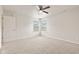 Bright bedroom featuring neutral carpet, a ceiling fan, and large windows at 6332 Long River Ln, Indianapolis, IN 46221