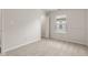 A bright bedroom with carpet and a window at 6332 Long River Ln, Indianapolis, IN 46221