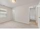 A bedroom with multiple access doors and a window at 6332 Long River Ln, Indianapolis, IN 46221
