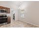Bright dining area with tiled floor and stainless steel appliances adjacent at 6332 Long River Ln, Indianapolis, IN 46221