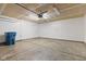 Clean and spacious garage with concrete floors, a pedestrian door, and an electric door opener at 6332 Long River Ln, Indianapolis, IN 46221