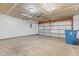 Spacious two car garage featuring an automatic garage door opener, concrete floors, and ample space for parking and storage at 6332 Long River Ln, Indianapolis, IN 46221