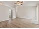 Spacious living room with hardwood floors, plenty of light, and open to other rooms at 6332 Long River Ln, Indianapolis, IN 46221