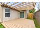 Wooden patio showcasing the home's backyard access through a sliding door, perfect for entertaining at 6332 Long River Ln, Indianapolis, IN 46221