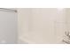 This minimalist shower features a pristine, neutral bathtub with a sleek shower head at 6332 Long River Ln, Indianapolis, IN 46221