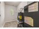 Well-lit utility room with tiled flooring, and HVAC with hot water tank at 6332 Long River Ln, Indianapolis, IN 46221