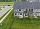 Landscaped backyard featuring a lush lawn, a cozy patio, and a charming sitting area at 640 Axford Bay Dr, Westfield, IN 46074