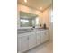 Bathroom features a double sink vanity with granite counters, a large mirror, and modern finishes at 640 Axford Bay Dr, Westfield, IN 46074
