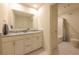 Bright bathroom with double vanity, granite countertop, and a large mirror, complemented by sleek tile flooring at 640 Axford Bay Dr, Westfield, IN 46074