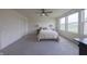 Large bedroom showcases a ceiling fan, many windows, and neutral-toned furnishings at 640 Axford Bay Dr, Westfield, IN 46074