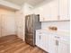 Bright kitchen offers stainless appliances, white cabinets, and stone countertops with a breakfast bar at 640 Axford Bay Dr, Westfield, IN 46074
