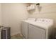 Functional laundry room with a washer and dryer, complemented by wire shelving for organized storage solutions at 640 Axford Bay Dr, Westfield, IN 46074