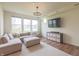 Bright living room with a large sectional sofa, modern lighting, and beautiful hardwood floors at 640 Axford Bay Dr, Westfield, IN 46074