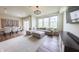 Bright living room with a large sectional sofa, modern lighting, and beautiful hardwood floors at 640 Axford Bay Dr, Westfield, IN 46074