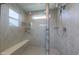 Glass-enclosed shower features a bench, tiled walls, and multiple shower heads at 640 Axford Bay Dr, Westfield, IN 46074
