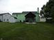 Spacious backyard features a covered patio, shed, and plenty of room for outdoor activities at 6714 Colleens Way, Indianapolis, IN 46221