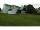 This backyard offers a shed and covered patio perfect for relaxing at 6714 Colleens Way, Indianapolis, IN 46221