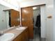 Bathroom featuring a double sink vanity and a sliding door closet at 6714 Colleens Way, Indianapolis, IN 46221