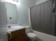 Clean bathroom with a shower-tub combination, updated fixtures, and a wood vanity at 6714 Colleens Way, Indianapolis, IN 46221