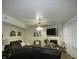 Cozy living room features a fireplace, comfortable seating, and a ceiling fan at 6714 Colleens Way, Indianapolis, IN 46221