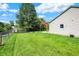 Large grassy backyard with a quaint pergola that adds a touch of charm at 6842 Sextant Dr, Indianapolis, IN 46260