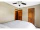 Well-lit bedroom featuring neutral walls, a queen bed, and an open closet for easily accessible storage at 6842 Sextant Dr, Indianapolis, IN 46260