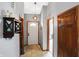Welcoming foyer with neutral walls, tiled flooring, and decorative light fixture at 6842 Sextant Dr, Indianapolis, IN 46260
