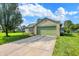 Ranch-style house with a green lawn, brick accents, an attached garage, and blue skies at 6842 Sextant Dr, Indianapolis, IN 46260
