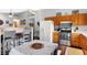 Open kitchen with a breakfast bar, stainless steel appliances, and ample counter space at 6842 Sextant Dr, Indianapolis, IN 46260
