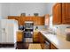 Functional kitchen featuring stainless steel appliances, ample counter space, and wooden cabinets at 6842 Sextant Dr, Indianapolis, IN 46260