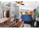 Open-concept living room flowing into the kitchen, featuring dark floors and modern decor at 6842 Sextant Dr, Indianapolis, IN 46260