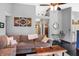 Cozy living room featuring a comfortable sectional sofa, high ceilings, and stylish decor at 6842 Sextant Dr, Indianapolis, IN 46260
