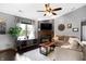 Bright living room featuring a fireplace, large window, and a comfortable sectional sofa at 6842 Sextant Dr, Indianapolis, IN 46260