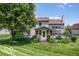 Expansive backyard featuring a deck with a pergola and lush landscaping with a large tree providing shade at 7211 Topp Creek Ct, Indianapolis, IN 46214