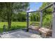 Relaxing backyard swing on a spacious deck, surrounded by lush greenery and a well-maintained lawn at 7211 Topp Creek Ct, Indianapolis, IN 46214